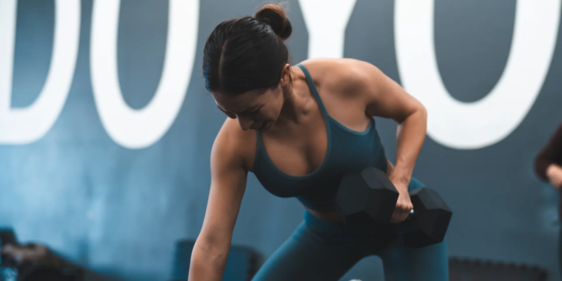 Woman working out with dumbbells